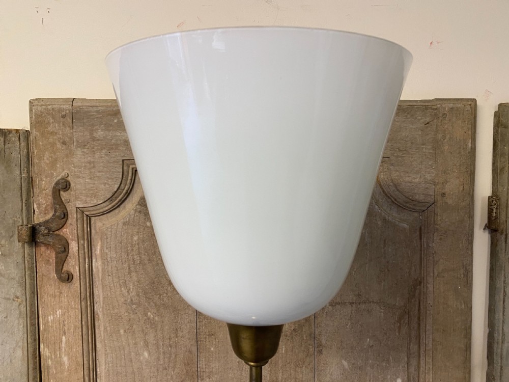 A French brass standard lamp featuring a fluted column shaft, scroll tripod base, and a white opal glass shade. View XII