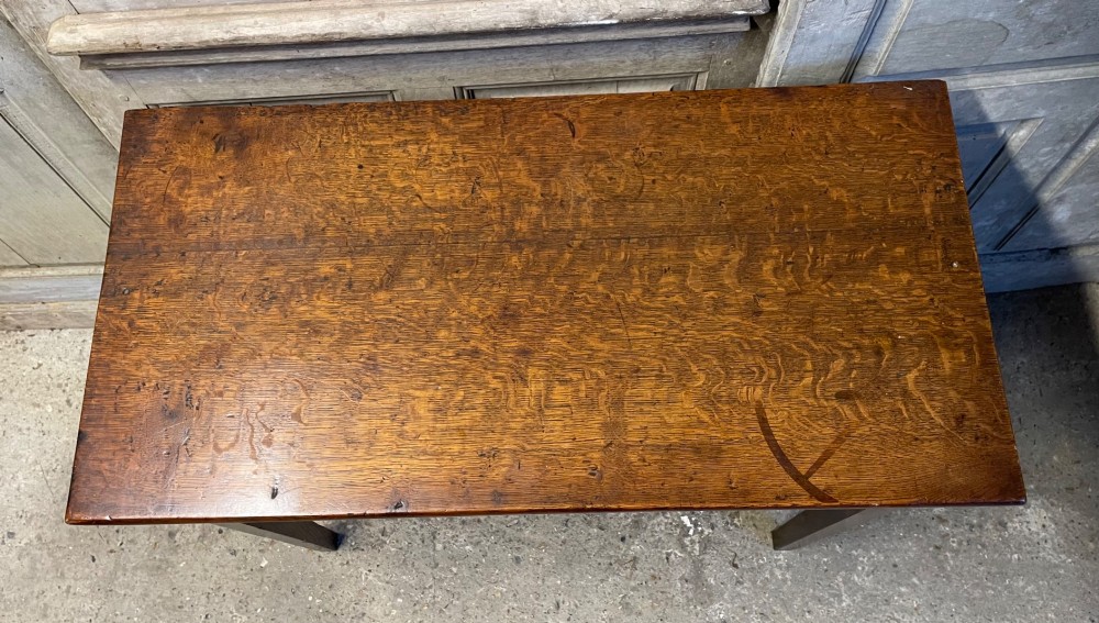 A Georgian oak fold-over tea table featuring a single central frieze drawer with a brass drop handle and straight tapered legs. View III