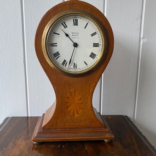 An Edwardian Inlaid Mahogany Balloon-shape Mantel Clock by Asprey London