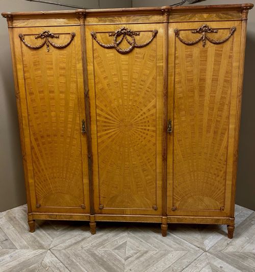 An Edwardian Satinwood Triple Wardrobe Circa 1910