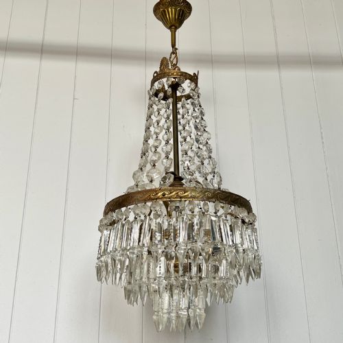 A Tent and Tiered Vintage Chandelier