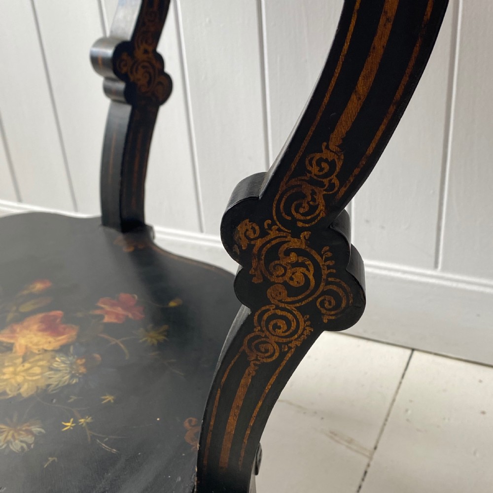 A Victorian ebonised black wooden sewing table featuring hand-painted floral designs, a painted landscape scene on the lid, cabriole legs, and a lower undertier. View IV