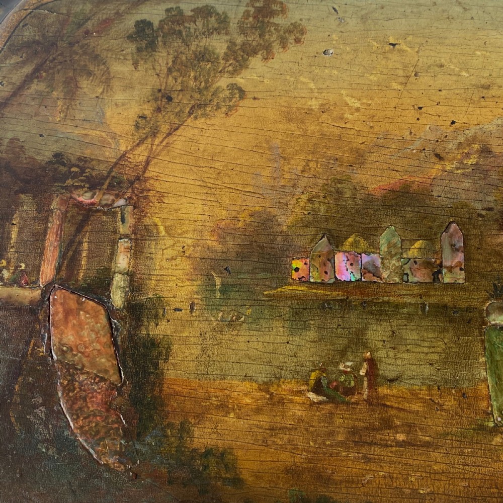 A Victorian ebonised black wooden sewing table featuring hand-painted floral designs, a painted landscape scene on the lid, cabriole legs, and a lower undertier. View XV