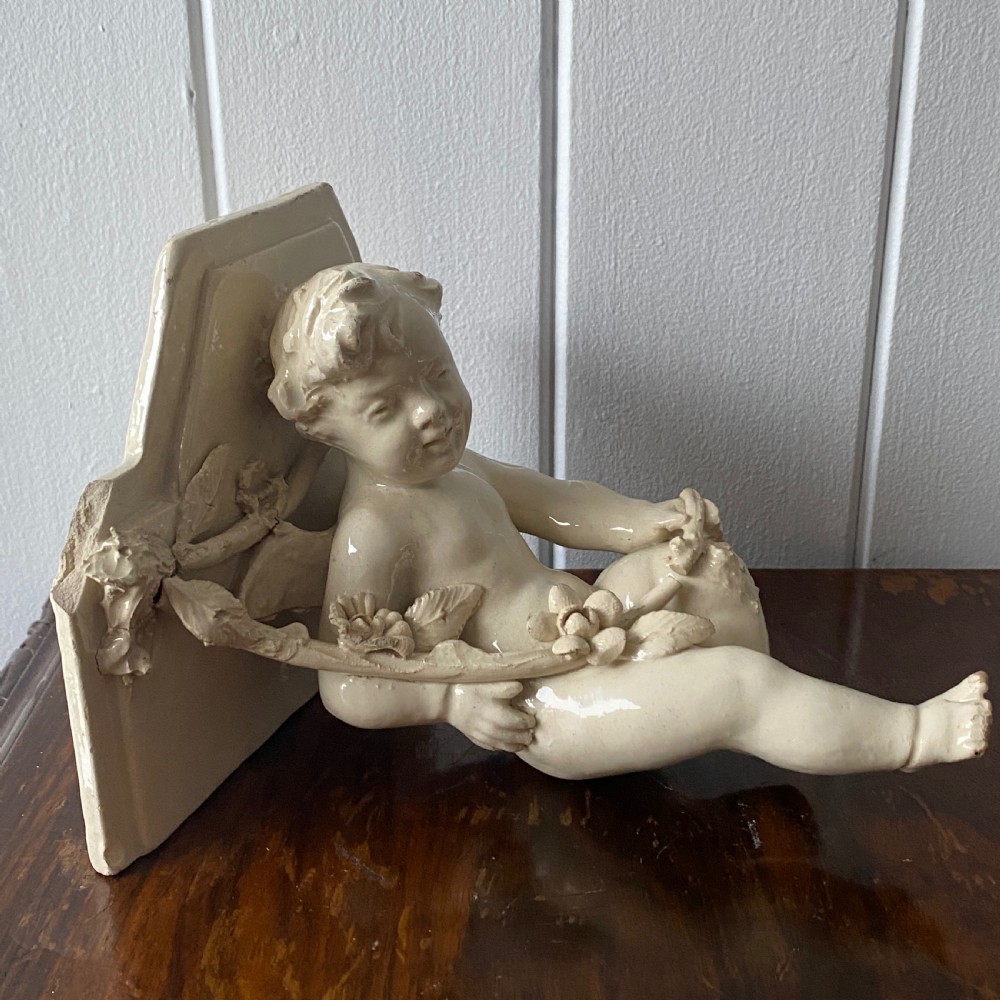 A Vintage French Ceramic Wall Bracket or Book End In The Form Of A Cherub View II