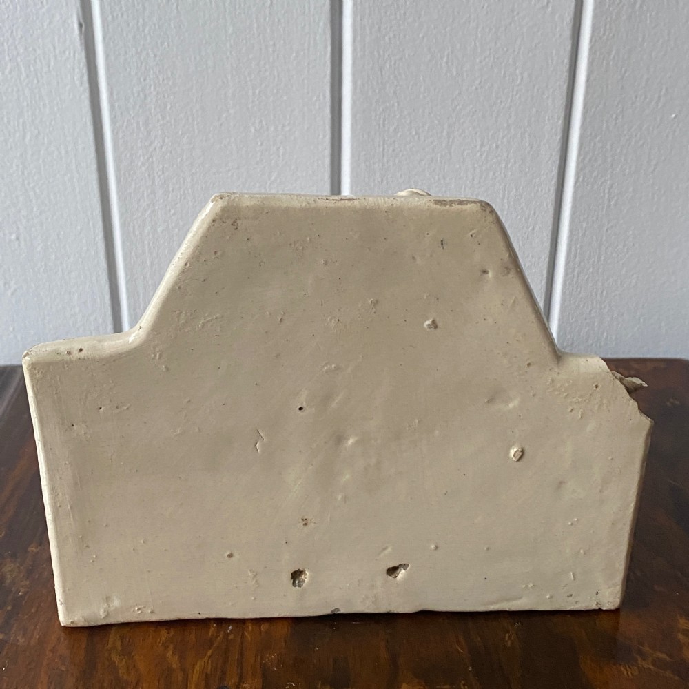 A Vintage French Ceramic Wall Bracket or Book End In The Form Of A Cherub View III
