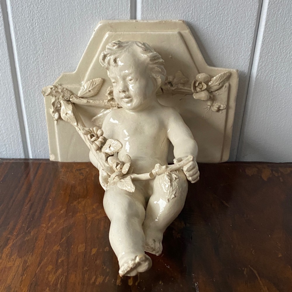 A Vintage French Ceramic Wall Bracket or Book End In The Form Of A Cherub View V