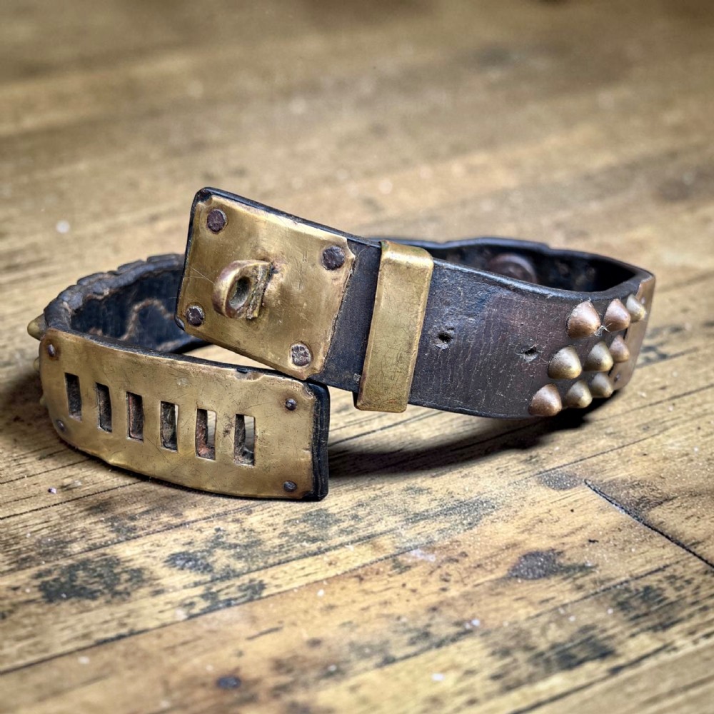 A 19th-century French dark leather dog collar featuring brass conical studs and an engraved brass nameplate. View II