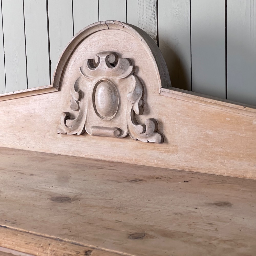 A Victorian carved pine console table featuring front cabriole legs, a central relief cartouche, and a shaped gallery backrest. View VIII