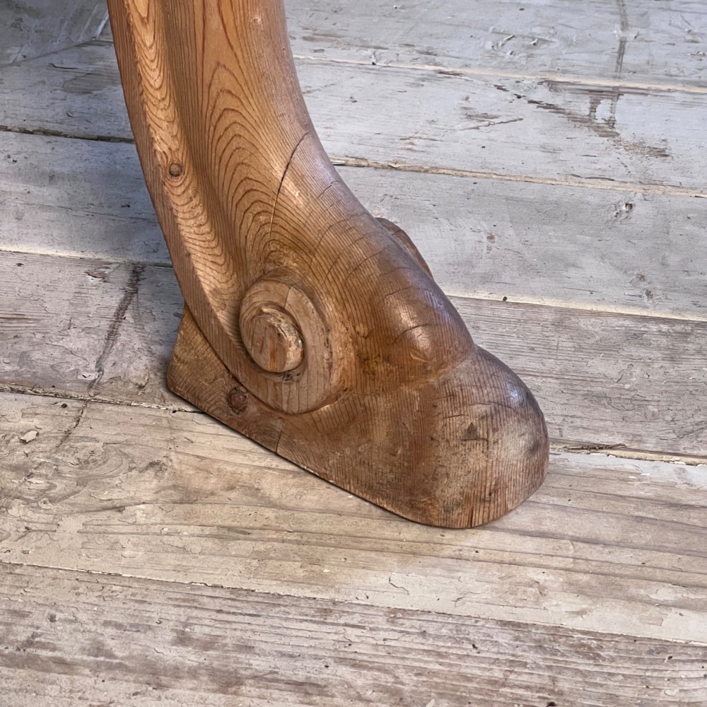 A Victorian carved pine console table featuring front cabriole legs, a central relief cartouche, and a shaped gallery backrest. View X