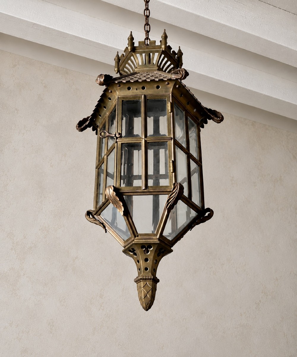 A large Continental Gothic Revival bronze hanging lantern featuring a castellated crown roof with turrets, scale detailing, and glass panels. View III
