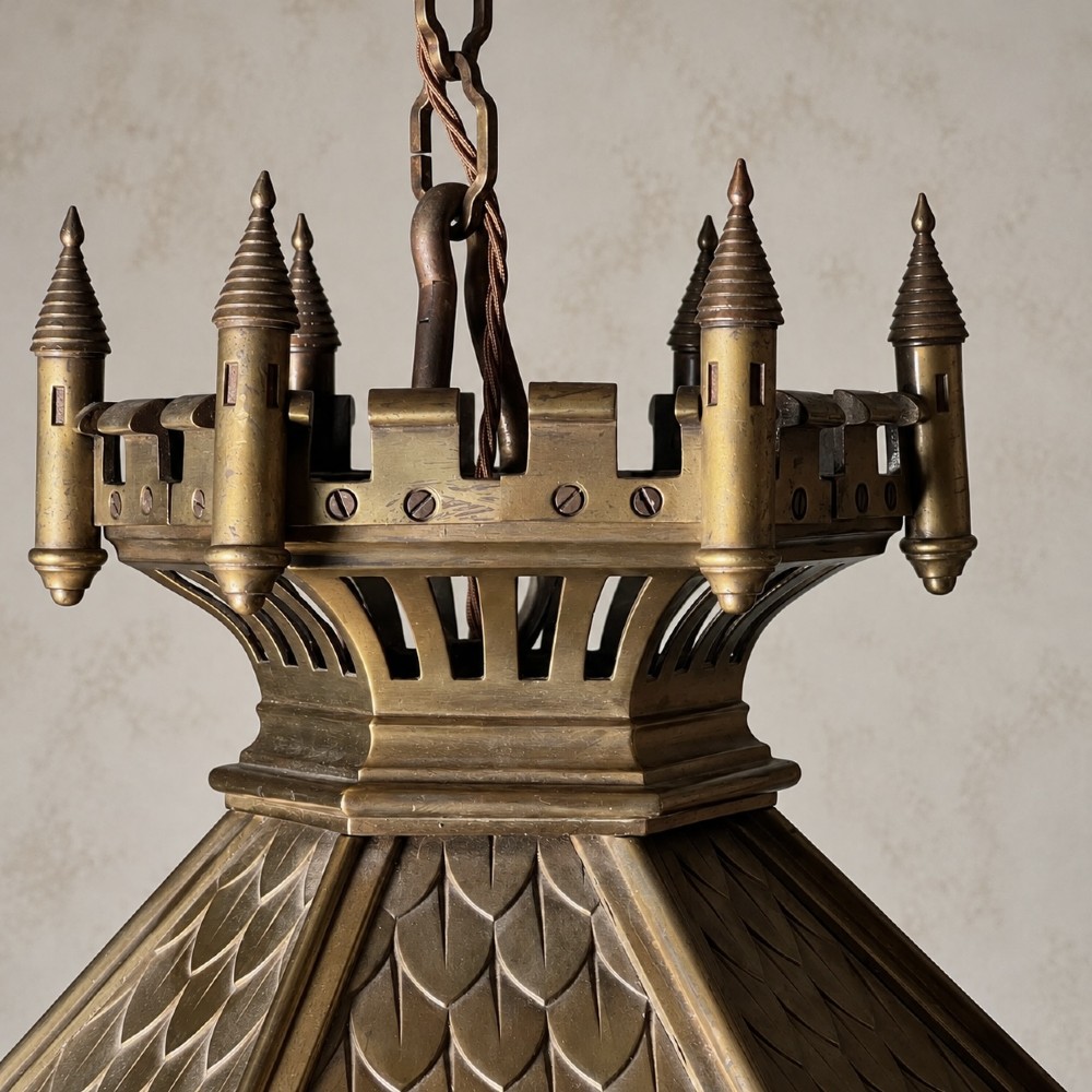 A large Continental Gothic Revival bronze hanging lantern featuring a castellated crown roof with turrets, scale detailing, and glass panels. View VII