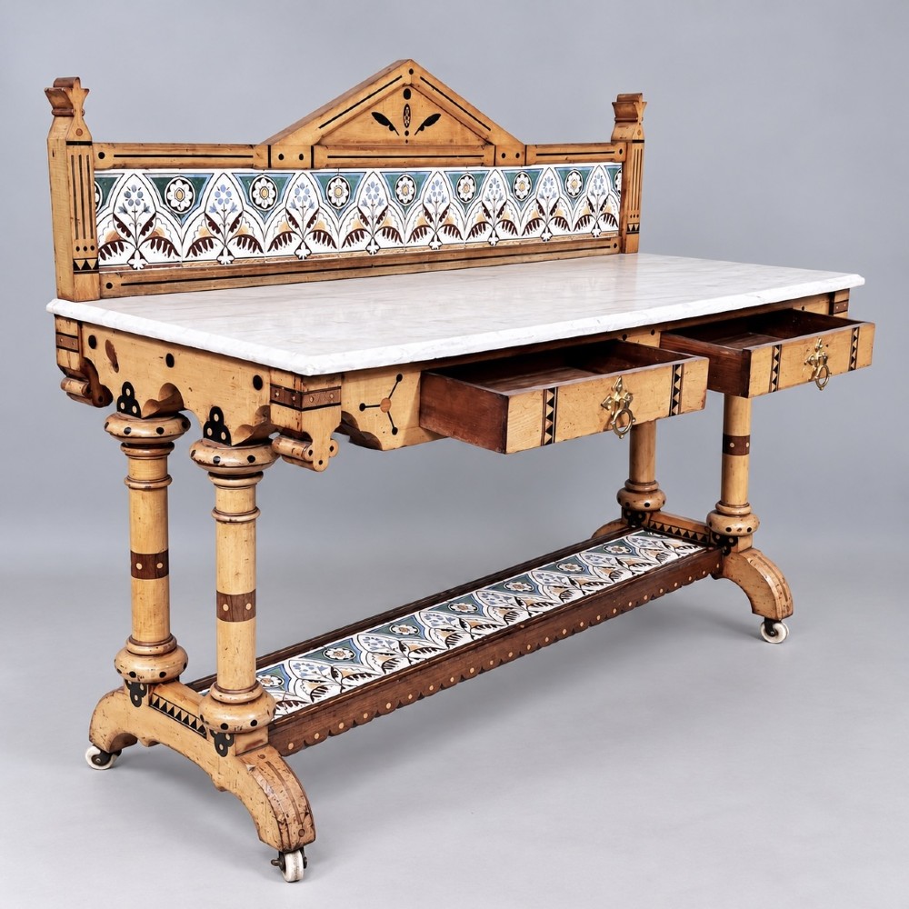 A Victorian Reformed Gothic washstand featuring a white marble top, turned legs, a tiled splashback, and geometric dark wood inlays. View III