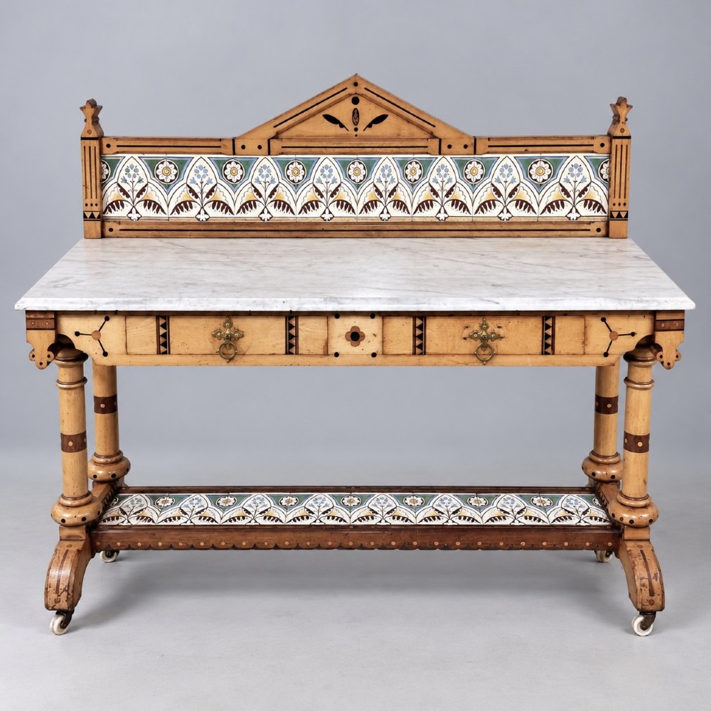 A Victorian Reformed Gothic washstand featuring a white marble top, turned legs, a tiled splashback, and geometric dark wood inlays. View IV
