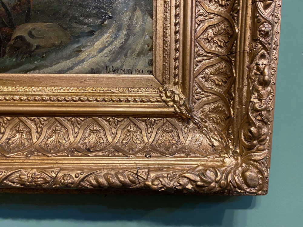 An antique oil painting depicting a river scene with a sailboat, distant castle on a hill, and mountains, housed in an ornate giltwood frame. View III