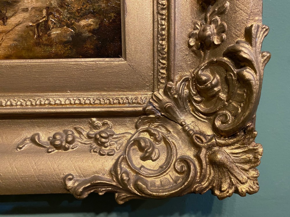A 19th-century oil painting on canvas depicting a rural thatched farmhouse cottage surrounded by trees, displayed inside an ornate gilded frame. View III