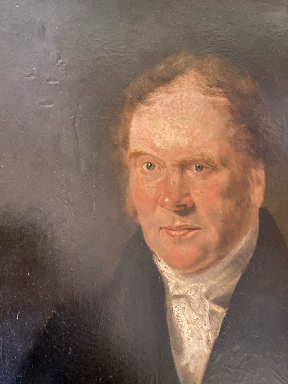A 19th-century oil painting on canvas depicting a red-haired gentleman in a black coat and white cravat, set inside a gold gilt frame. View II