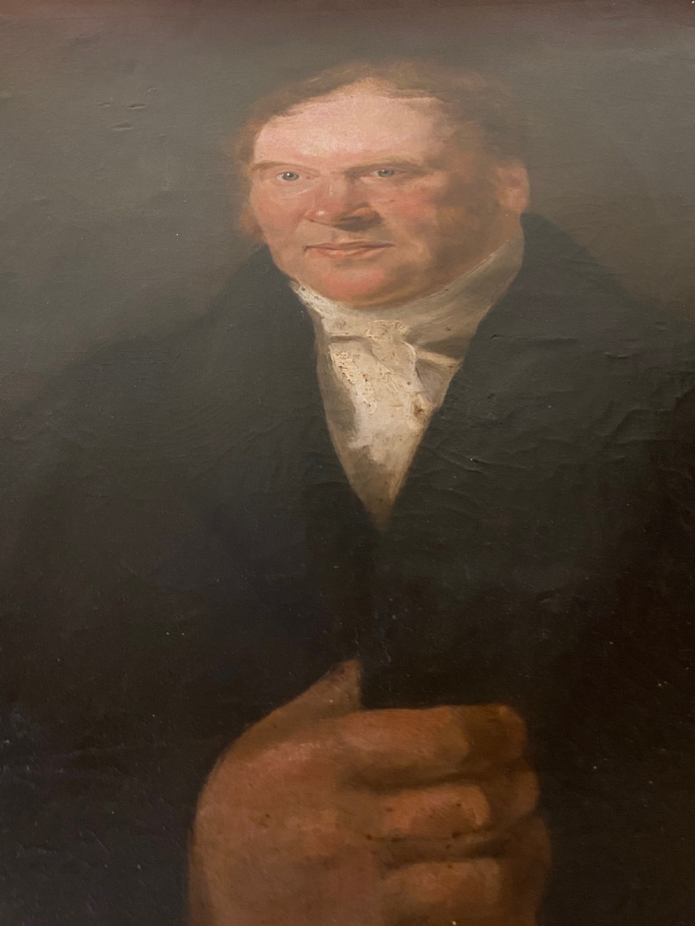 A 19th-century oil painting on canvas depicting a red-haired gentleman in a black coat and white cravat, set inside a gold gilt frame. View III