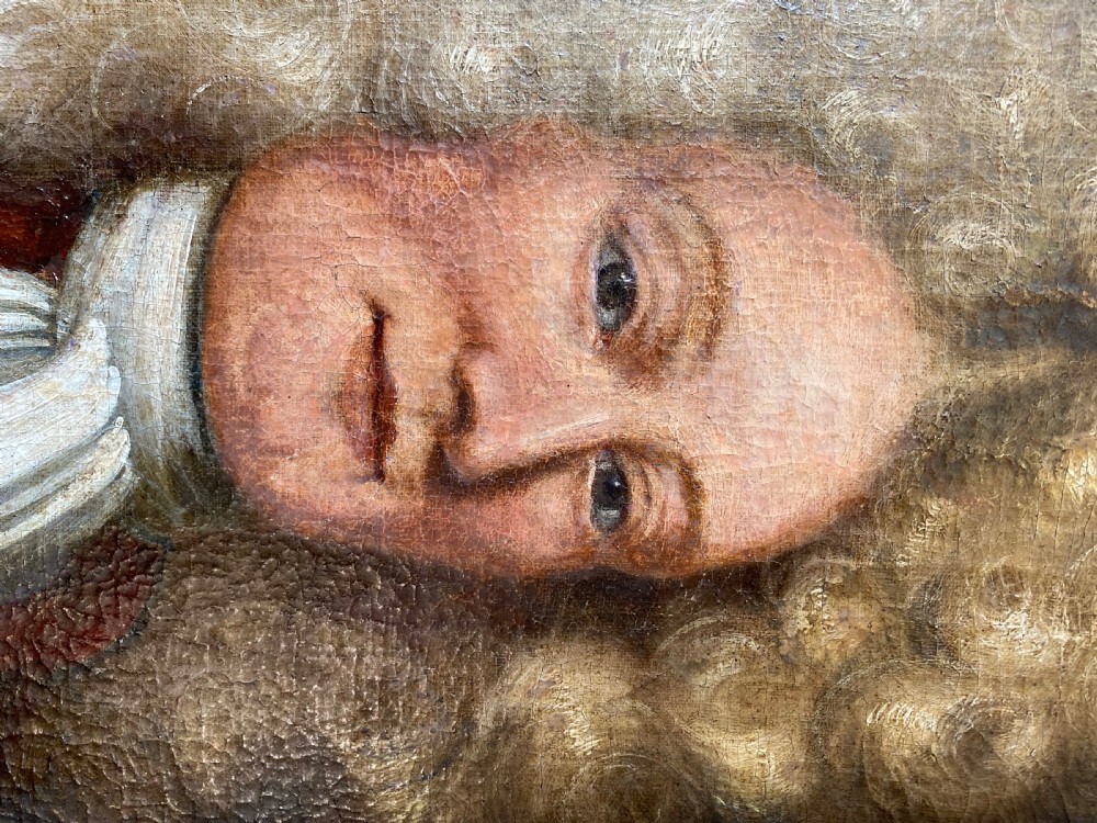 An 18th-century oil painting depicting a gentleman wearing a powdered wig and white cravat, framed within a wide oak wood border. View III