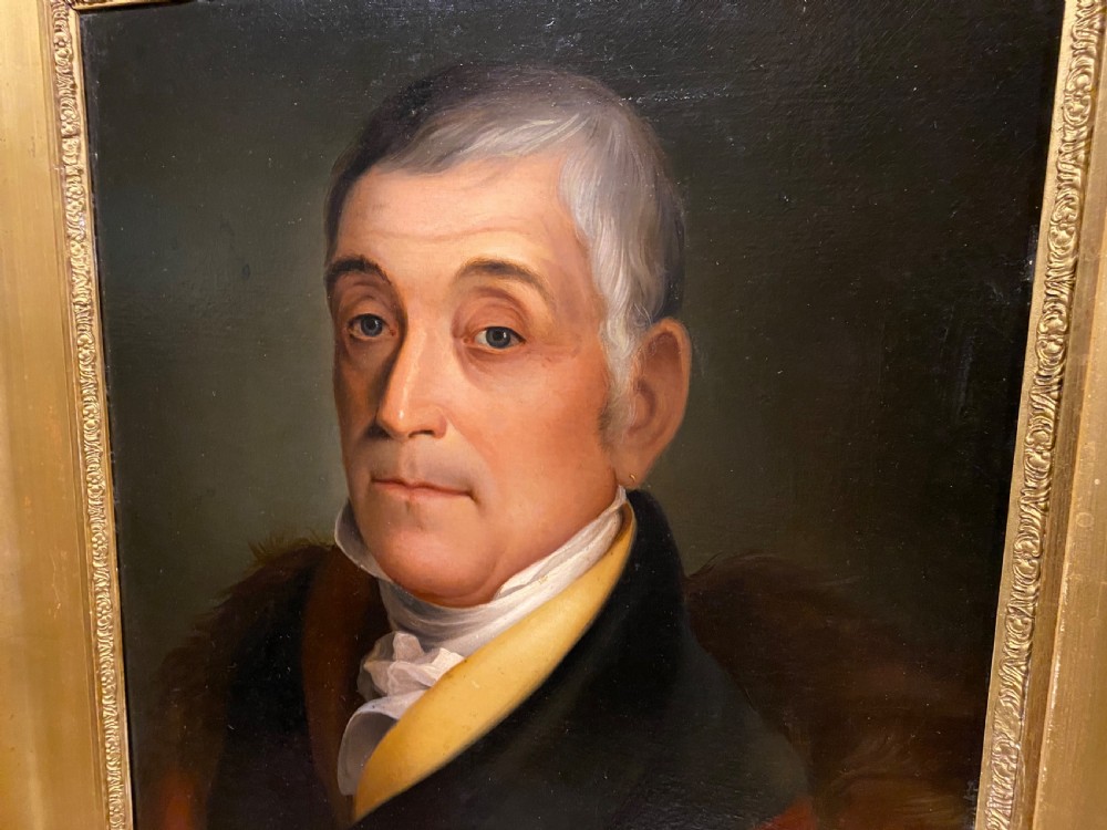 A 19th-century oil portrait depicting a gentleman with grey hair, a yellow collar, and a fur-trimmed coat, framed within a molded giltwood frame. View III