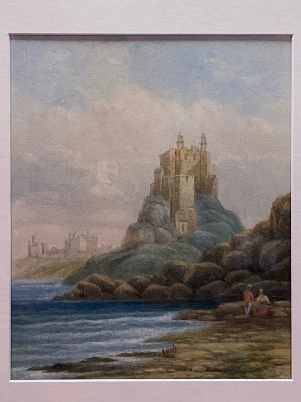 A 19th-century watercolour painting depicting a stone castle perched atop a rocky coastal outcrop alongside a calm sea.