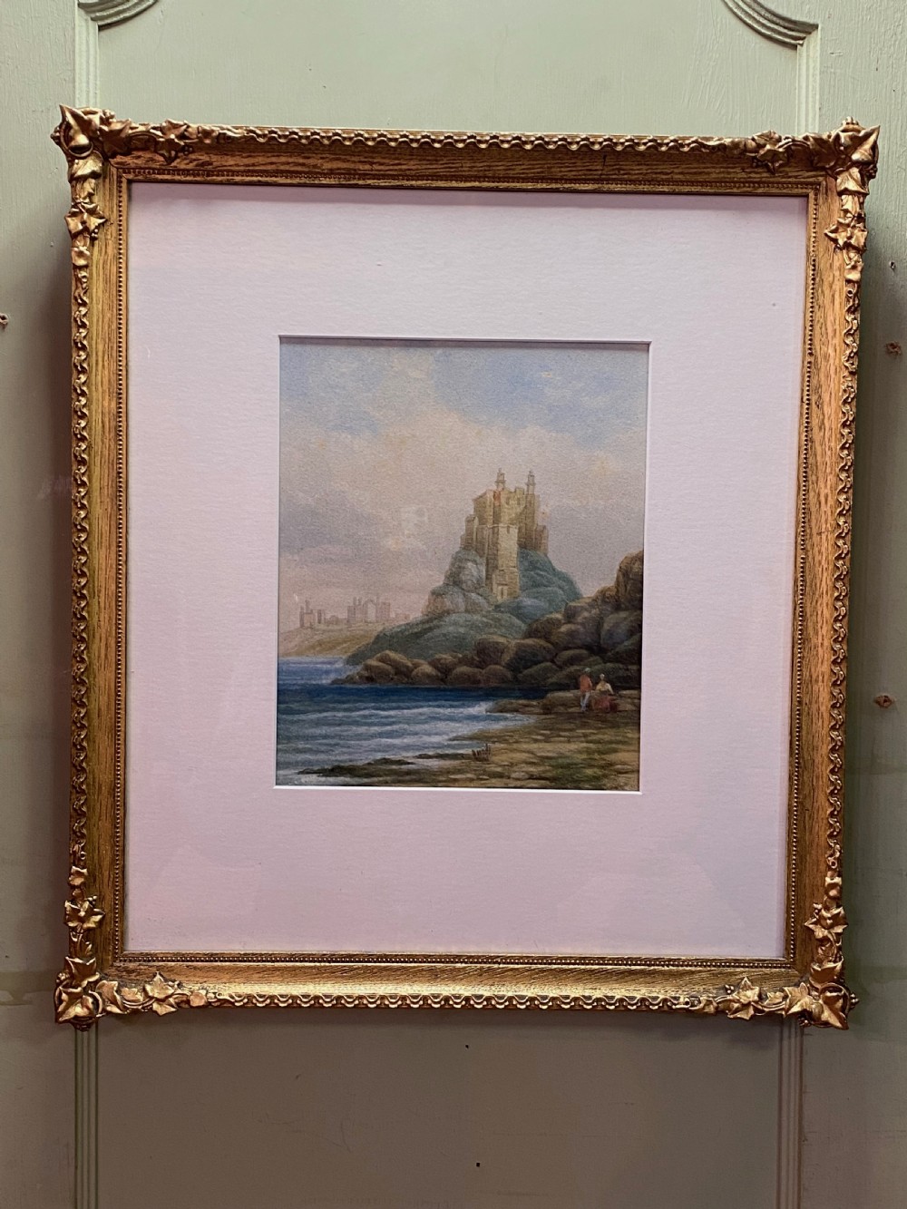 A 19th-century watercolour painting depicting a stone castle perched atop a rocky coastal outcrop alongside a calm sea. View II