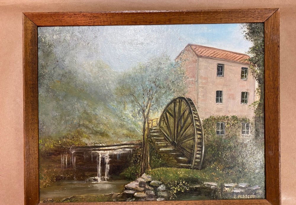 A rectangular framed oil painting illustrating a stone water mill beside a stream and waterfall, signed by E. Prescott in the bottom right corner. View II