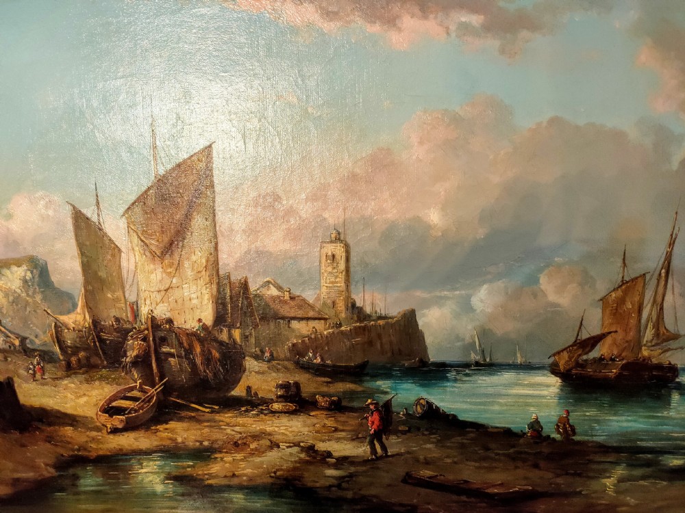 A 19th-century oil painting depicting fishermen and sailing vessels in a coastal harbour, housed in an ornate gilt swept frame. View II