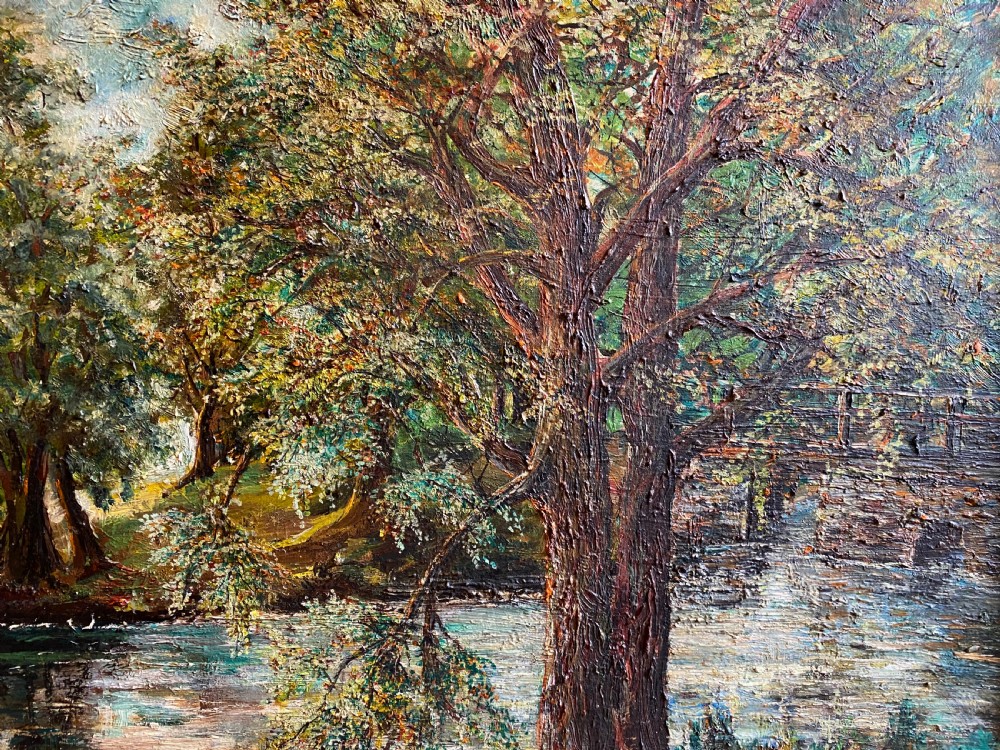 A framed oil painting featuring a heavily textured woodland riverbank scene with large trees leaning over a body of water in a dark wooden frame. View II