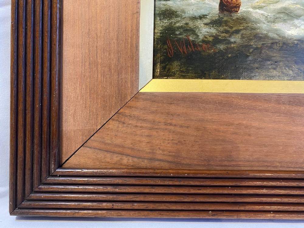A 19th-century oil painting depicting sailing ships on choppy ocean waters set within a reeded wood frame with a gilt slip. View V