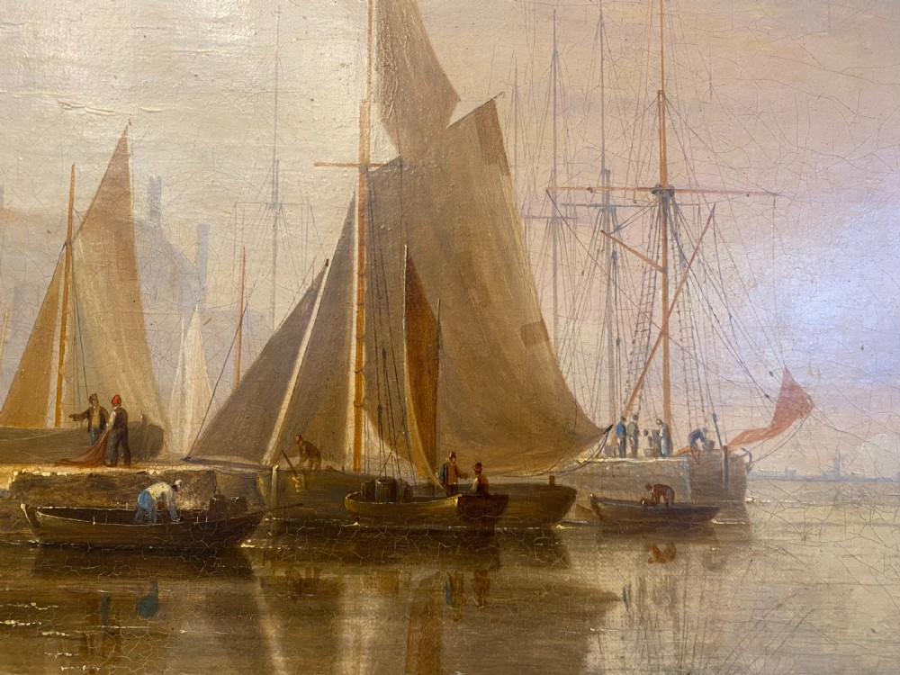 An early 19th-century marine oil painting depicting sailboats and fishermen in a harbour under a golden sky, set within a dark moulding frame with a gold slip. View IV