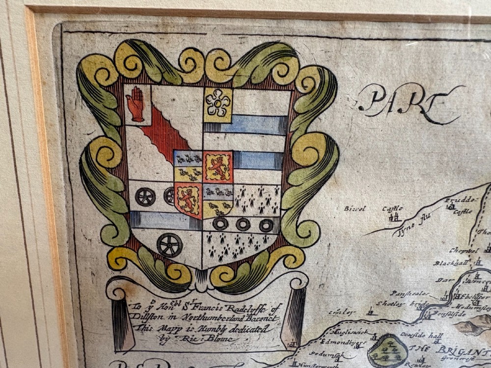 A framed 17th-century hand-coloured engraved map of County Durham by Richard Blome featuring a coat of arms and cartouche in a dark wood frame. View VIII
