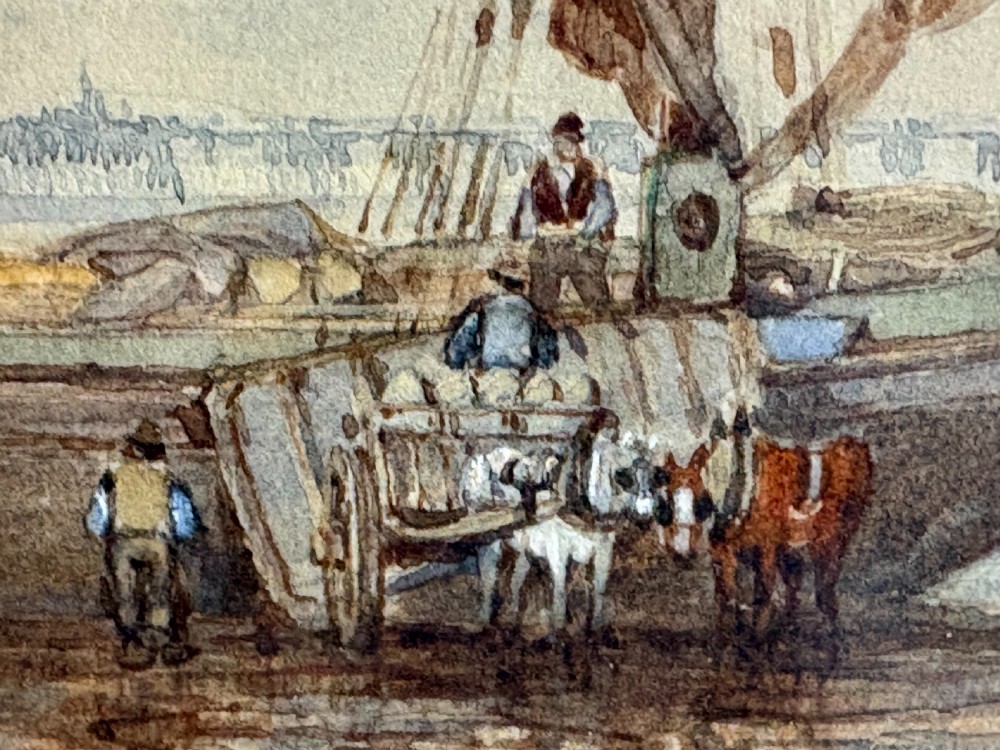 A 19th-century nautical watercolour depicting a wooden sailing vessel anchored in calm waters, enclosed in a cream mount and dark wooden frame with a carved gilt inner slip. View VI