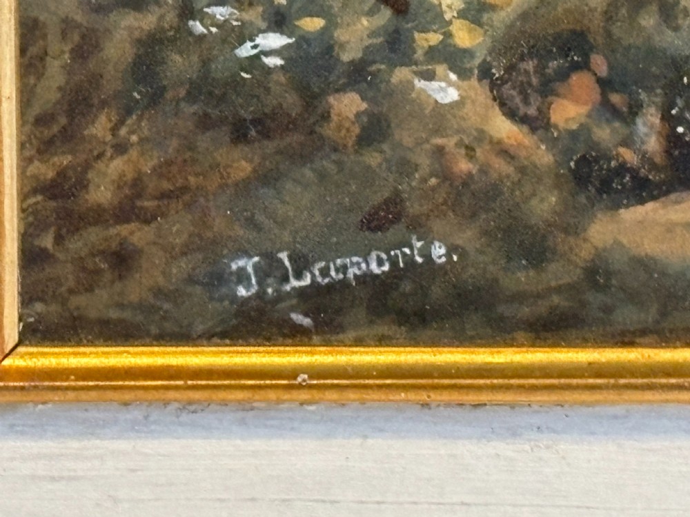 An antique framed watercolour painting depicting a lakeside landscape with figures and a sailboat, set within a moulded gilt frame. View IV