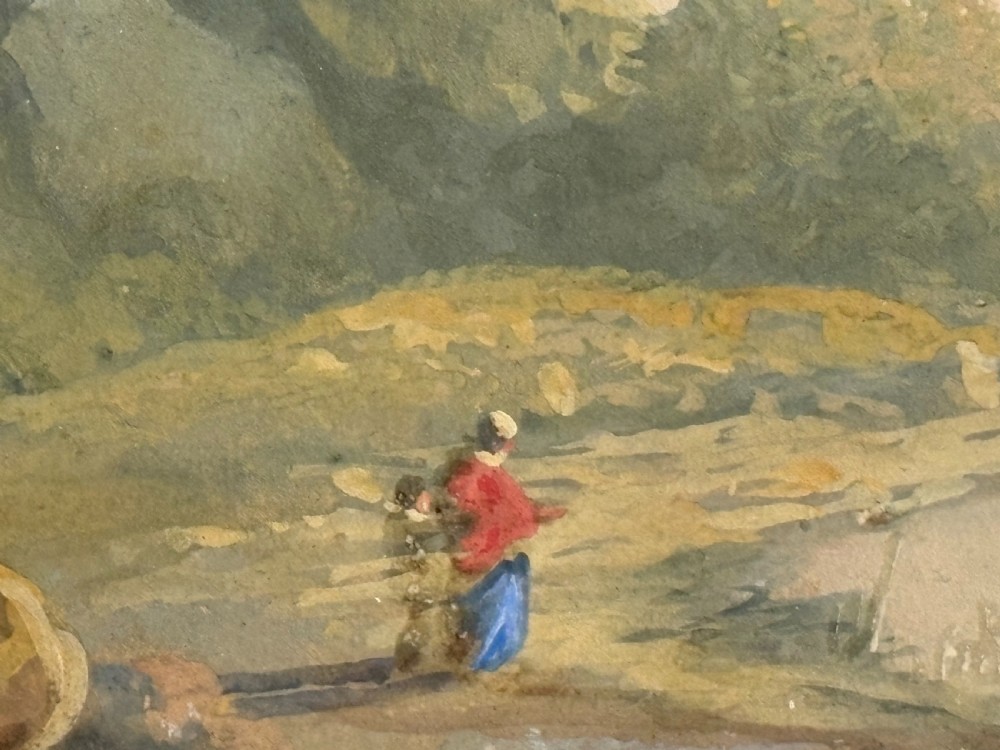 An antique framed watercolour painting depicting a lakeside landscape with figures and a sailboat, set within a moulded gilt frame. View V