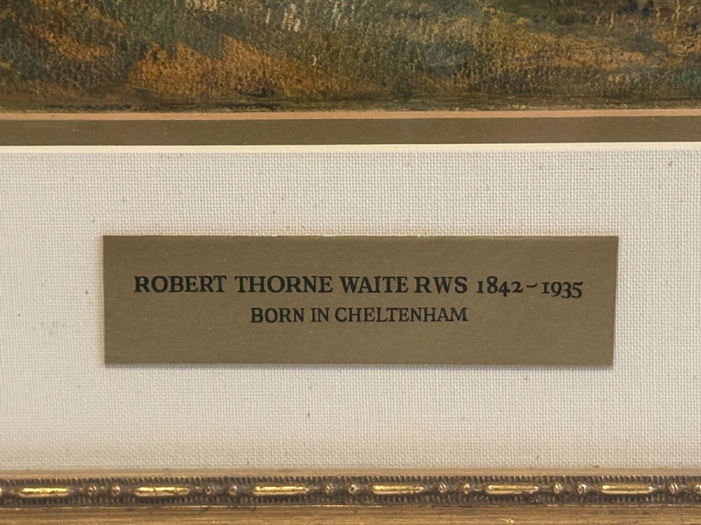 A framed Victorian watercolour painting by Robert Thorne Waite depicting cattle grazing beside a river in a pastoral landscape, set within a wide mount and a fluted gilt frame. View V