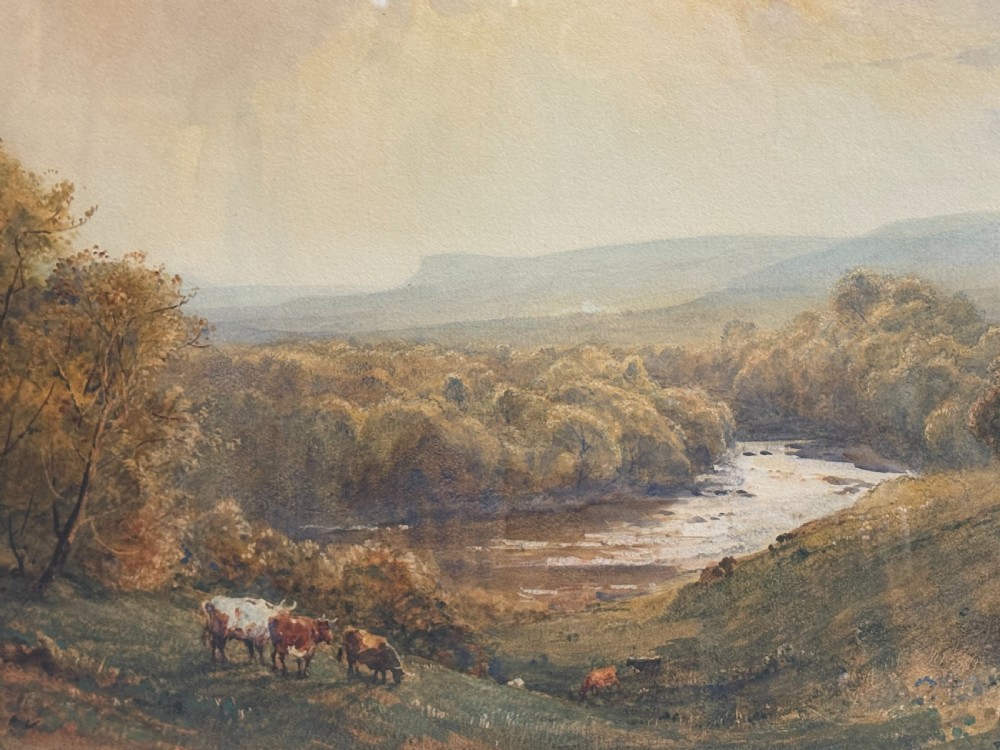 A framed Victorian watercolour painting by Robert Thorne Waite depicting cattle grazing beside a river in a pastoral landscape, set within a wide mount and a fluted gilt frame. View VII
