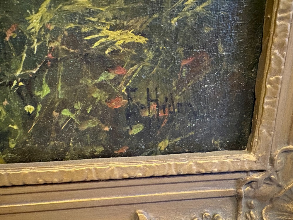 An antique oil painting on canvas depicting a mountainous lake landscape at sunset, housed in an ornate gilt frame. View IV