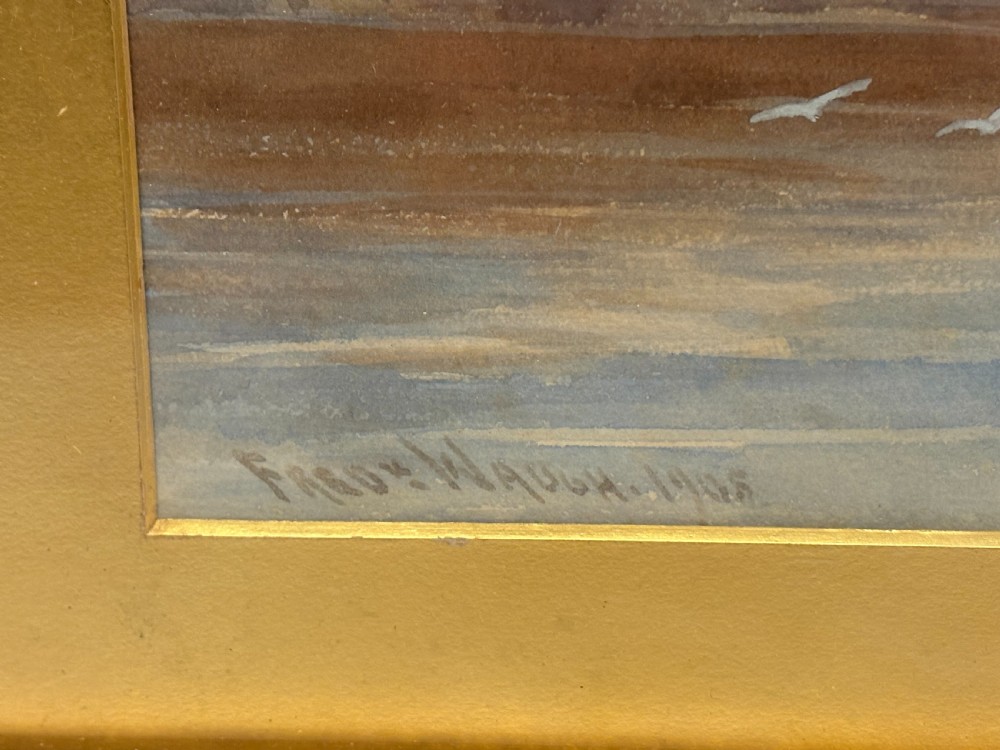 An Edwardian watercolour painting depicting fishing boats with reddish-brown sails in Whitby harbour, enclosed in a carved gilt frame. View IV