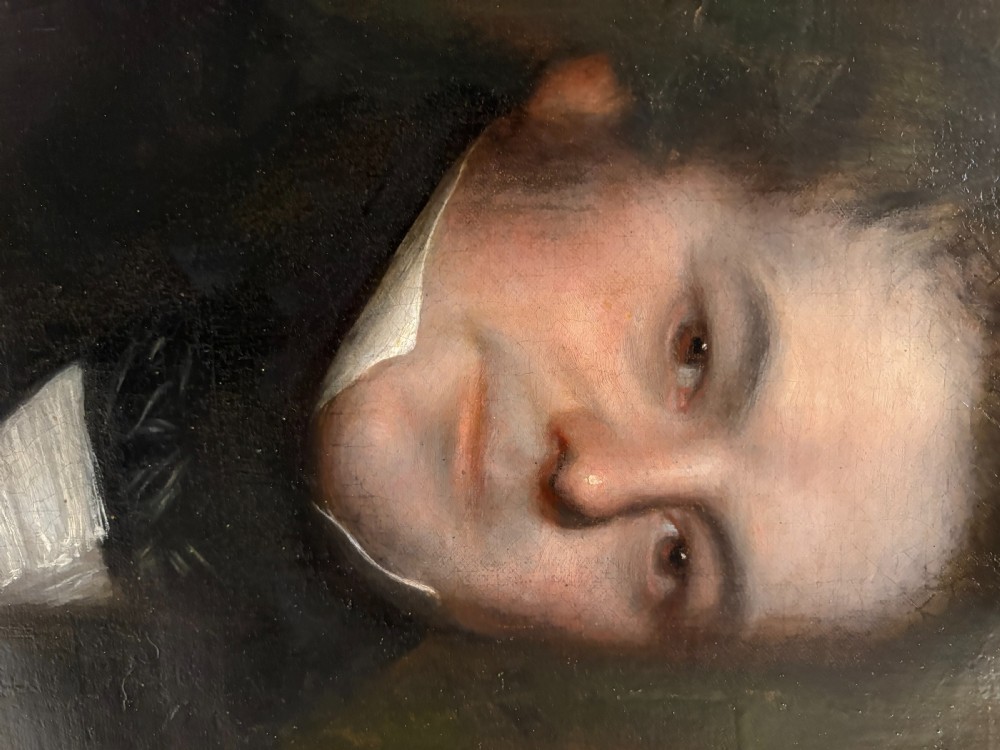 An early nineteenth-century oil portrait painting of a gentleman set inside an ornate gilt frame. View V