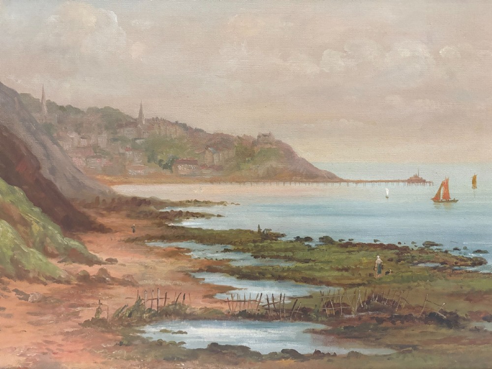 A late 19th-century oil painting on canvas depicting the rocky Scarborough coastline and sea with distant sailing boats, housed in a giltwood frame. View V