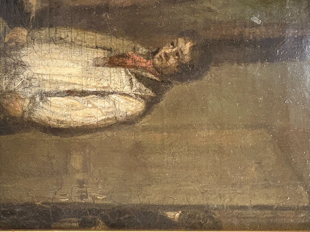 A 19th-century narrative oil painting depicting a master seated at a desk inside a dimly lit interior, set within a black ebonised frame with a gilded slip. View V
