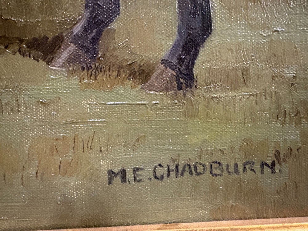 A mid-20th-century oil painting depicting a brown racehorse standing profile in a green field, housed in a fluted gold-coloured frame. View V