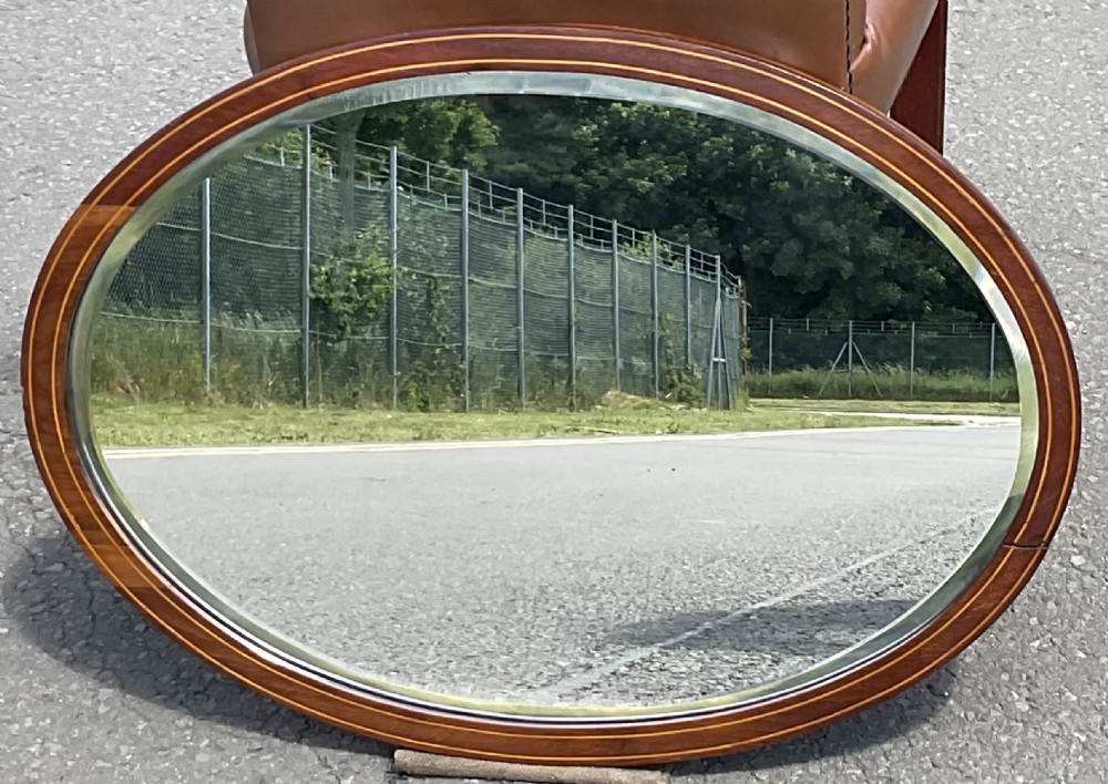 Edwardian oval inlaid mahogany hanging wall mirror 