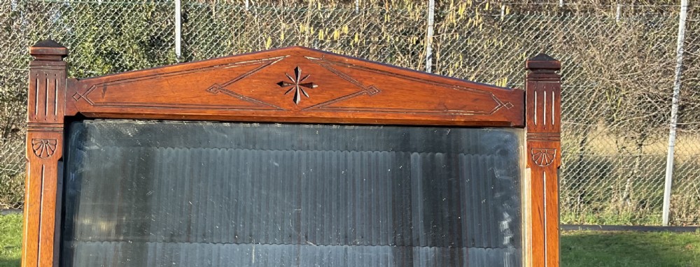 A Victorian burr walnut dressing table featuring a central adjustable rectangular mirror, tiered side drawers, turned front legs, and a shaped lower shelf. View V