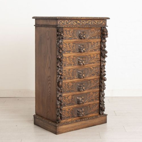 highly carved green man style oak wellington chest c1900 - CATEGORY: ANTIQUE CHEST OF DRAWERS - DATED 1900