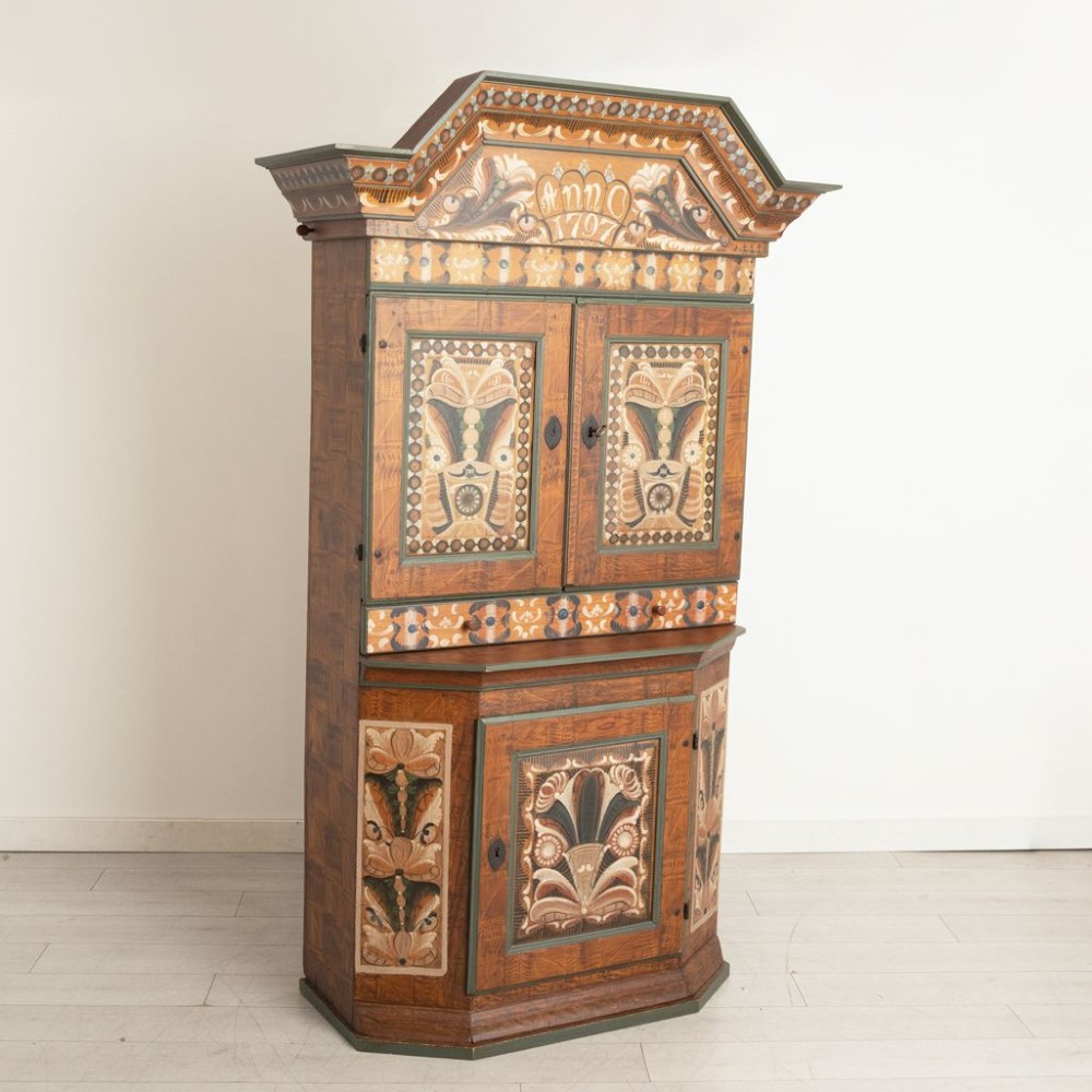 An eighteenth-century Swedish painted timber cupboard featuring two upper doors, a lower door, and decorative floral and geometric panels dated 1797. View II