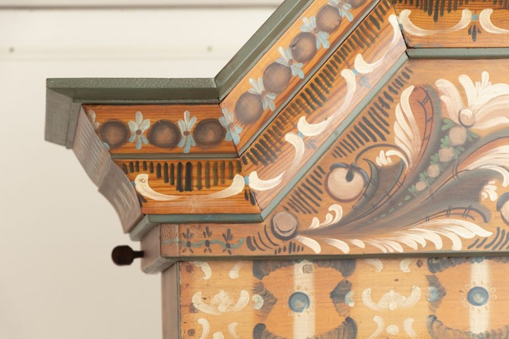 An eighteenth-century Swedish painted timber cupboard featuring two upper doors, a lower door, and decorative floral and geometric panels dated 1797. View VI