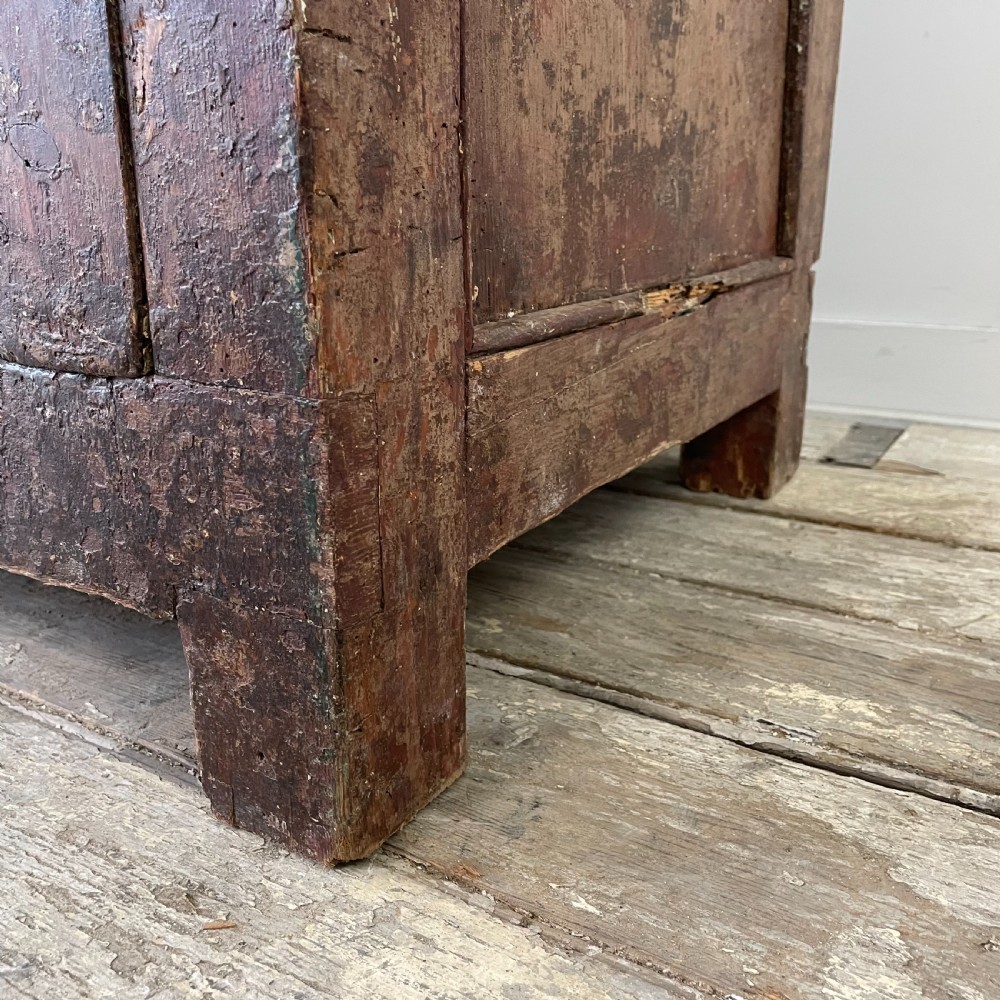 A late 18th-century dark brown painted pine food cupboard with arched mesh upper doors and fielded panel lower doors. View IX