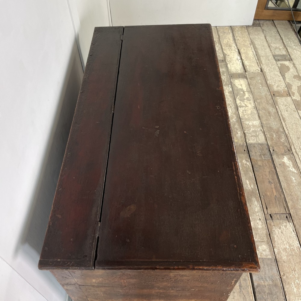 A dark red painted Georgian pine mule chest featuring a hinged top lid above two lower drawers with turned wooden knobs. View VII