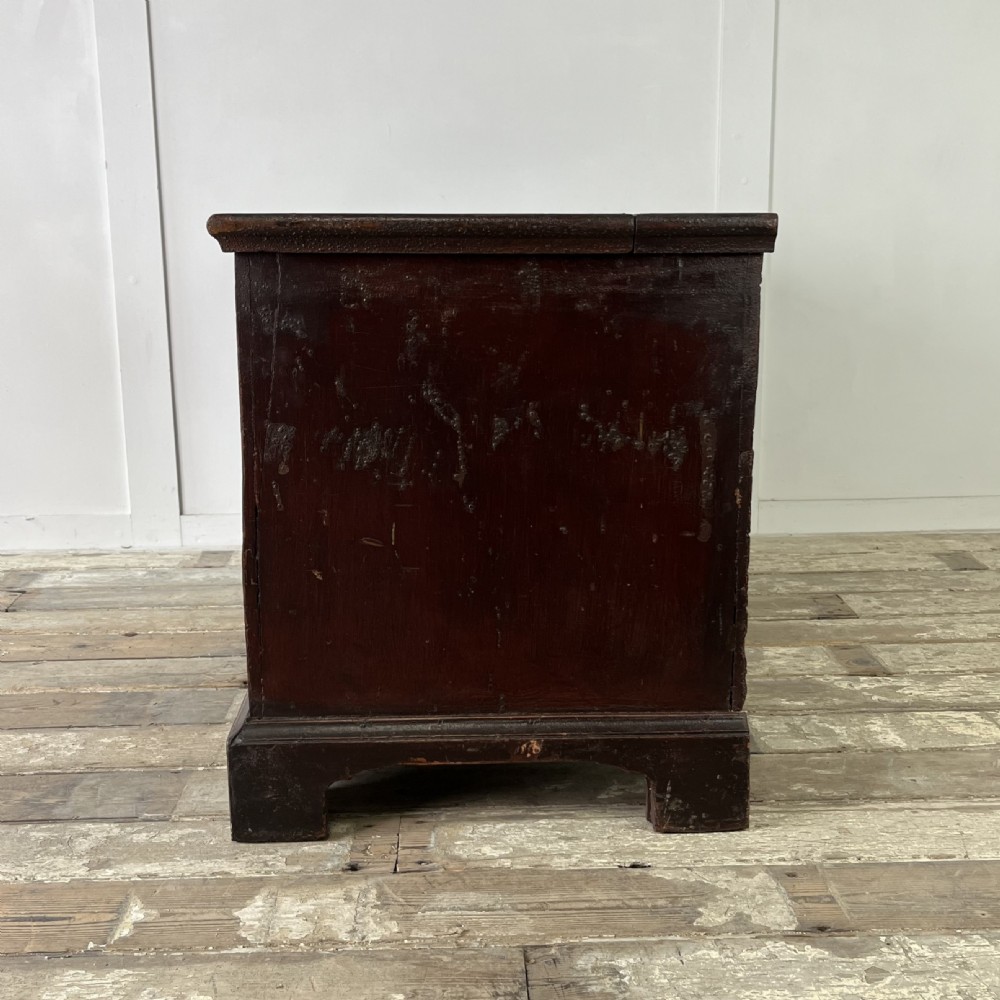 A dark red painted Georgian pine mule chest featuring a hinged top lid above two lower drawers with turned wooden knobs. View XIII